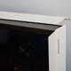 Here’s the corner of the Frame with the optional “customizable bezel” partially removed. The black bezel underneath is what the naked TV looks like. The decorate white bezel snaps on with magnets and costs over $200.